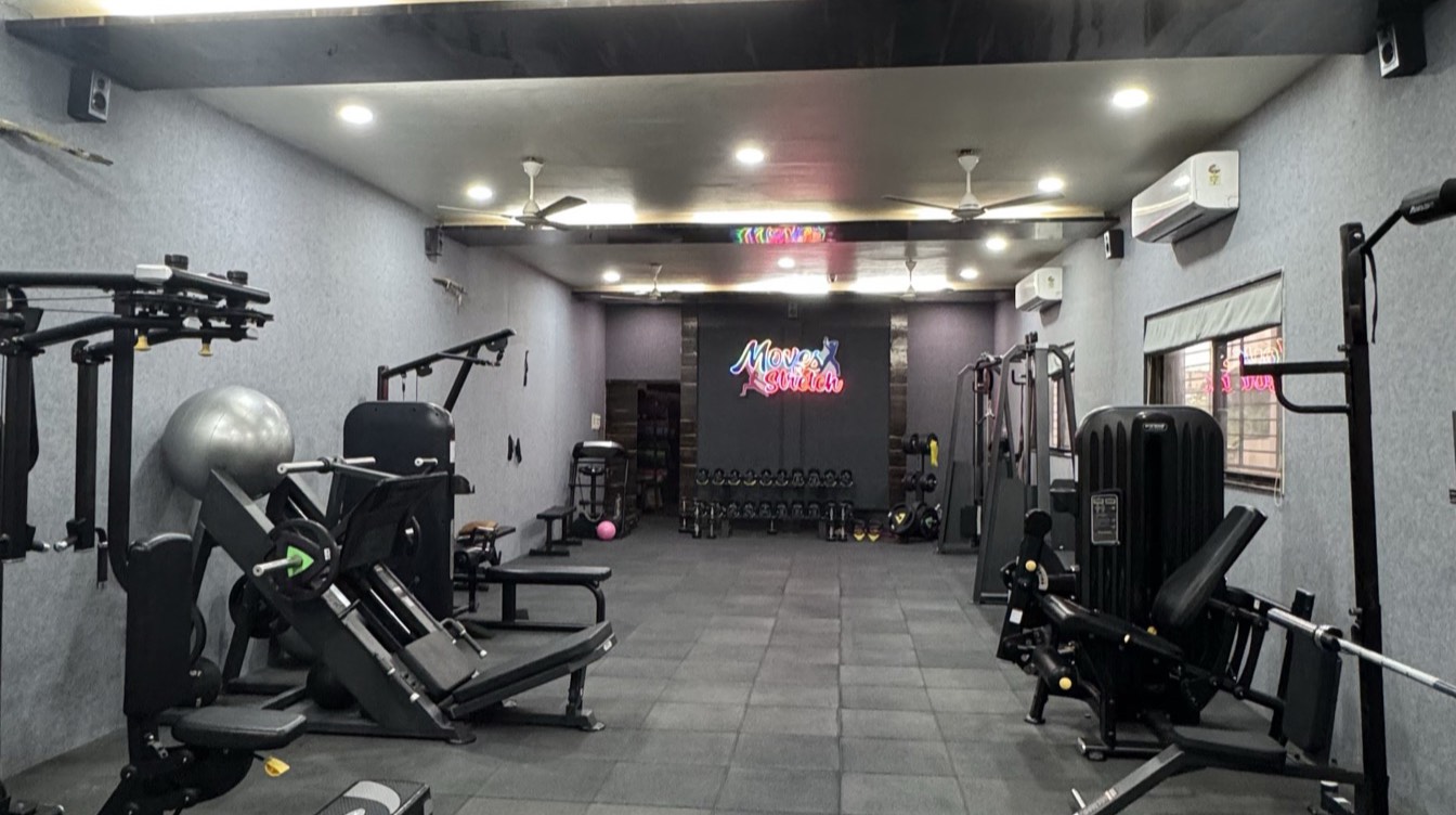 Training floor at the Moves n Stretch studio with resistance machines and free weights