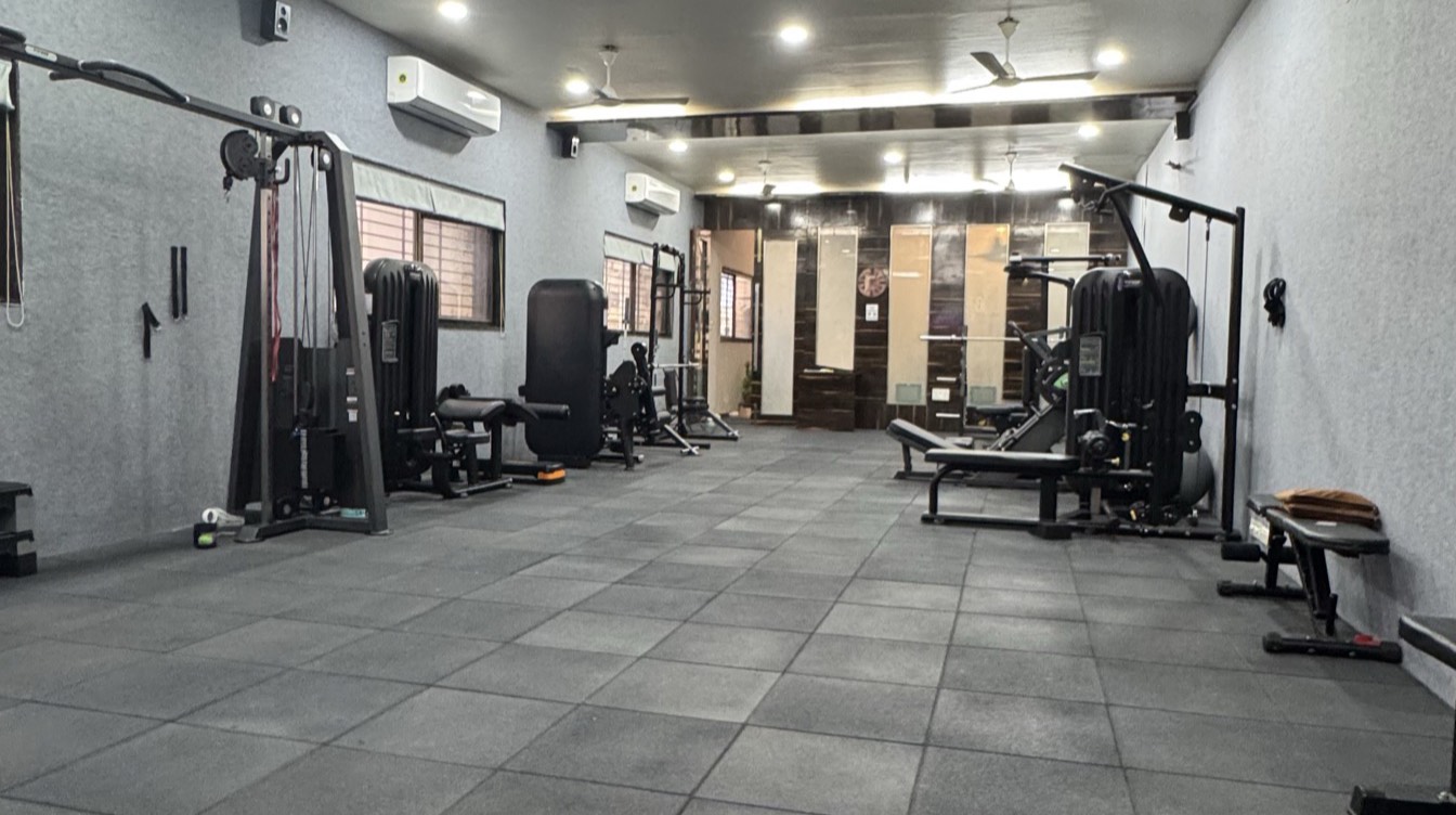 Open training floor at the Moves n Stretch studio with resistance machines and benches